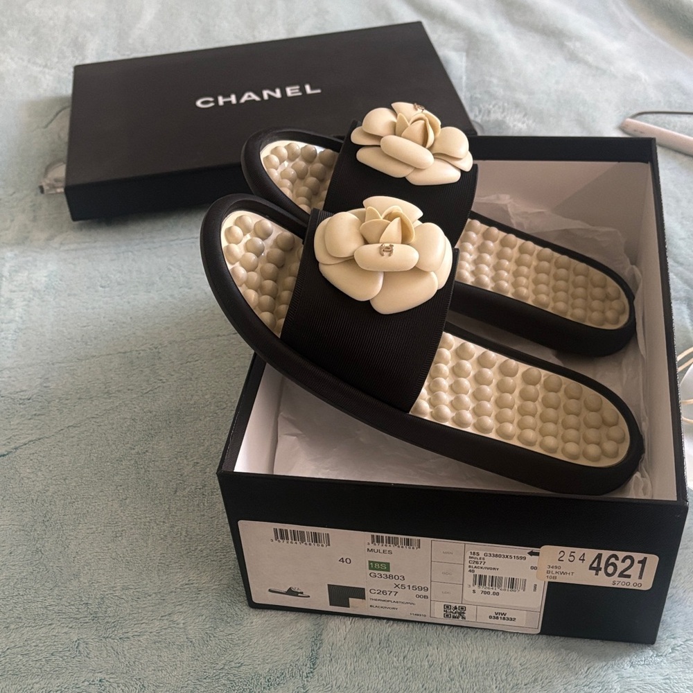 CHANEL Black and Cream Mules with Floral Accent - Picture 1 of 4
